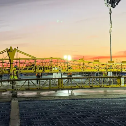A bridge deck concrete pour at sunset
