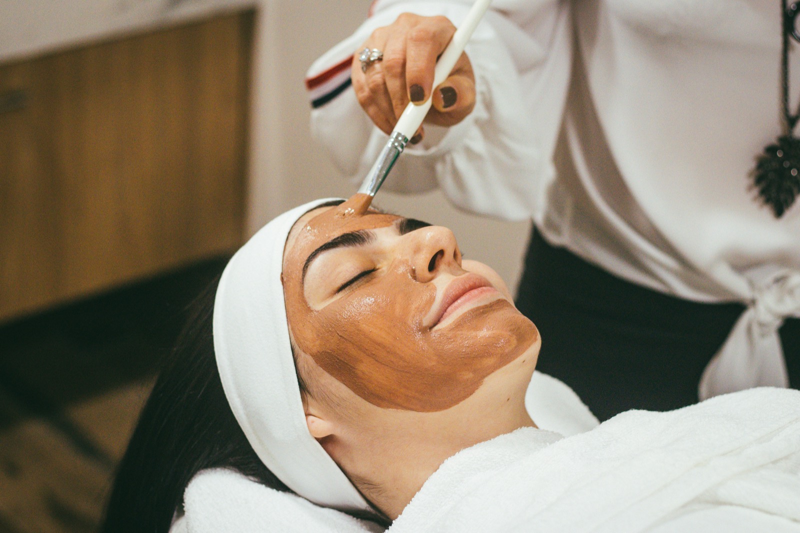 A client receiving a treatment at a wellness studio