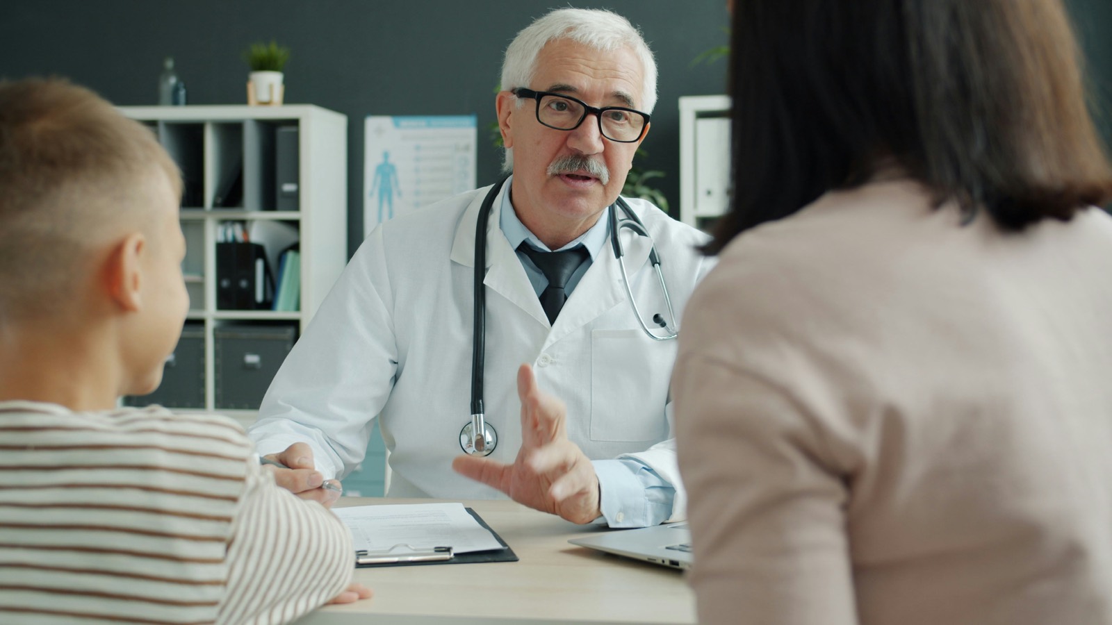 A clinician speaking with a patient