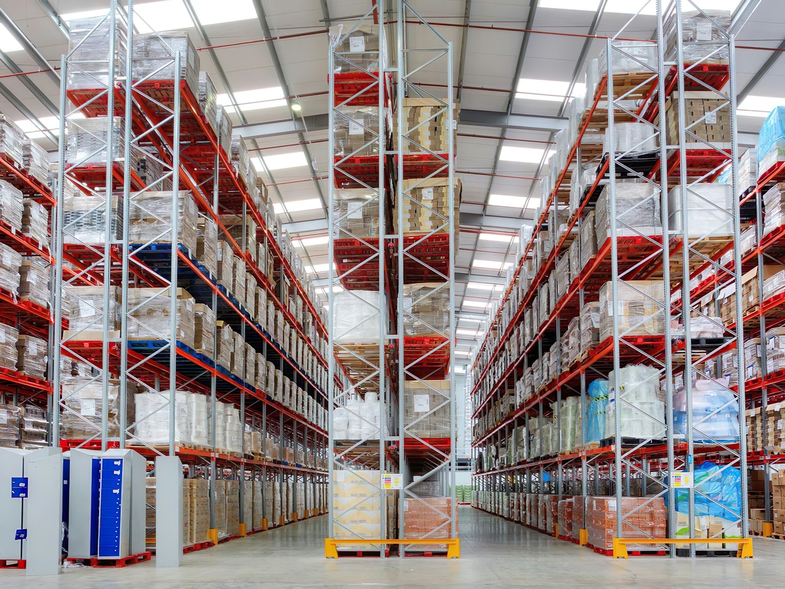 A distribution warehouse with stocked aisles